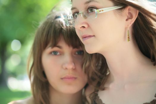 close-up portrait of the two young and beautiful girls