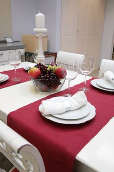 fruits in glass vase on table in interior of the modern kitchen