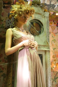 Feminine mannequin in beautiful fashionable cloth, festive luxury