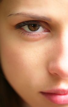 close-up portrait of the beautiful and young woman, part of the face