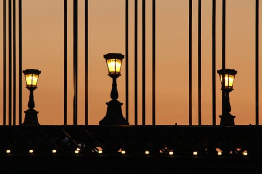 Chain Bridge in Budapest for three lights at dusk.