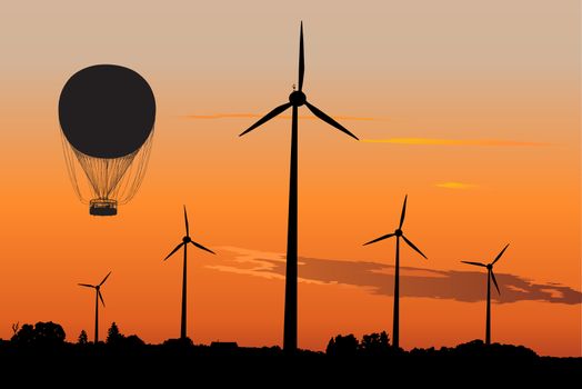 Silhouette of four windturbines and Air Baloon against sunset sky