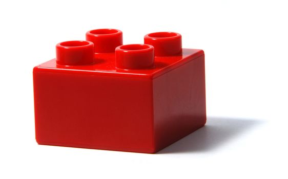 Single red duplo building block isolated on white background