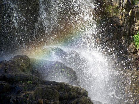 A rainbow in the spray of a waterfall