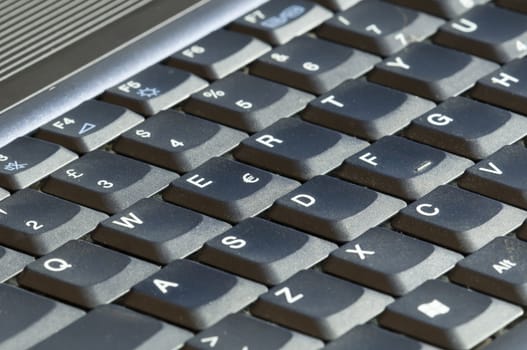 Closeup of a grey keyboard of a computer