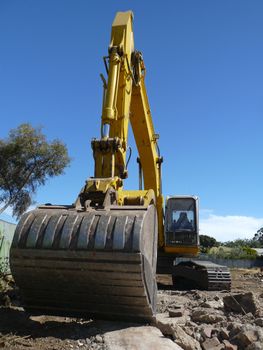 A powerful digger is parked at a building site