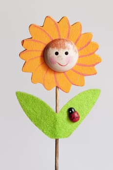 ornamental wood stick with sunflower and ladybug