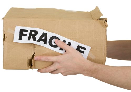 Crumpled cardboard box with inscription "fragile" on white background