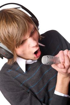 Young man singing wearing headphones isolated on white