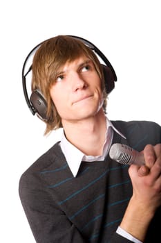 Young man singing wearing headphones isolated on white