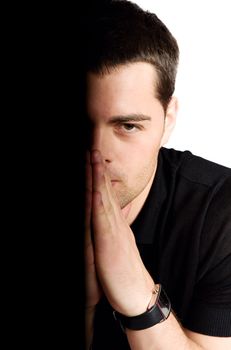 Half of young man's face isolated on white