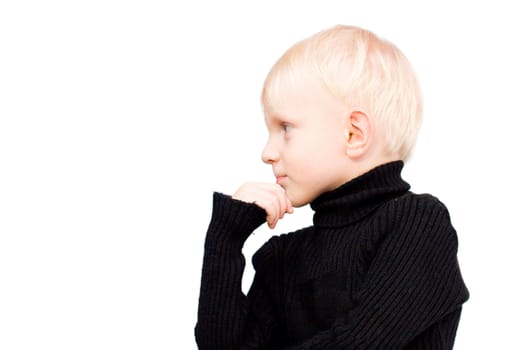 Pensive Serious boy with blond hair isolated