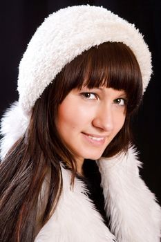 Young woman wearing white hat over black