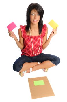 Attractive young woman on a white background with school or office supplies