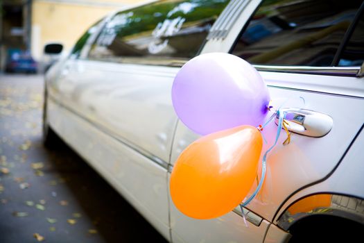 Wedding limousine decorated with baloons