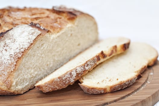 Slices of bread on a wooden plate