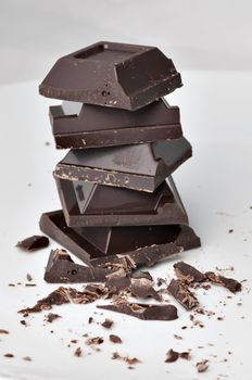 A pile of chocolate blocks on white background