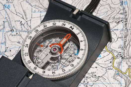 Modern compass on a map