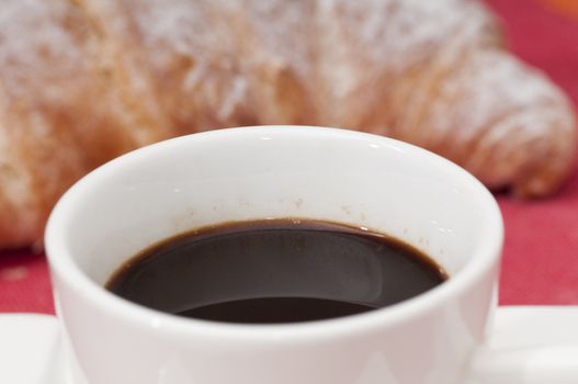 Continental breakfast with espresso coffee and a croissant