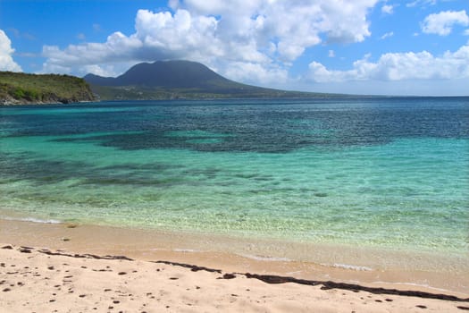 Tranquil beach and crystal clear water on Saint Kitts.