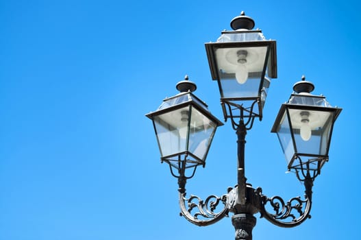 Traditional street lamp on deep blue sky