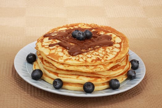pancakes and blueberries in a blue plate