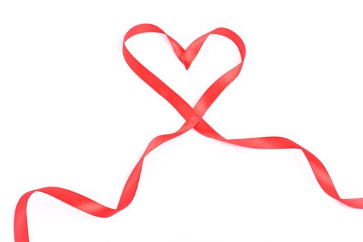 Red heart from ribbon for valentine isolated over white