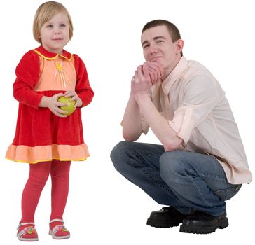 Little girl with green ripe apple and young man