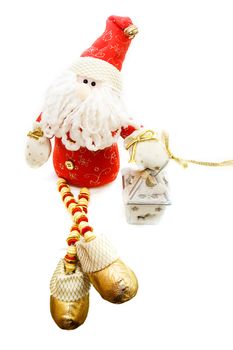 Santa Claus toy and candle over white