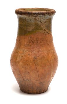 Ancient ceramic earthenware pot is isolated on a white background.