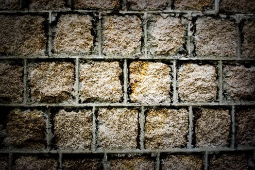 Grey brick textured wall background in a secret and dark mood