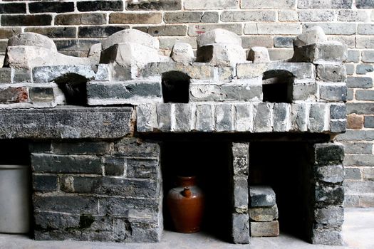 Old Chinese Kitchen with sunlight in Tai Fu Tai Mansion which is a heritage conservation architecture in Hong Kong