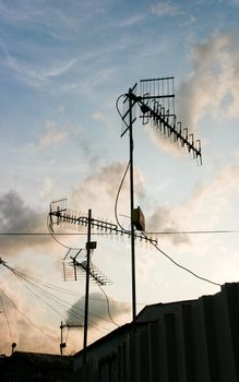 Several Antennae wiith sky under sunset