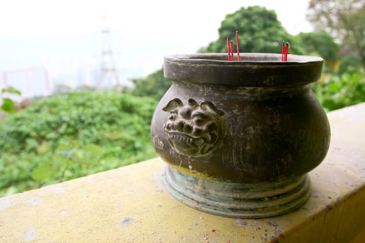 A Incense-pot with burning Incenses in a Buddhist temple