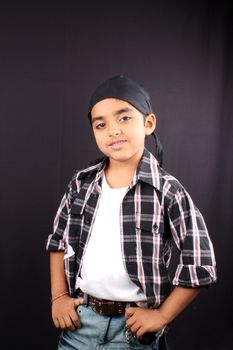 A cute Indian kid posing in style.