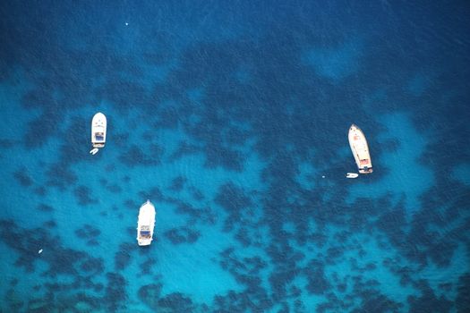 Yachts in the Mediterranean sea below the island of Capri.