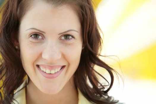 close-up portrait of the smiling merry girl with copy-space