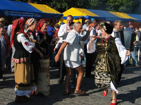 Cheerful national dances on a stone blocks during carrying out of fair in Kharkov Ukraine 19.08.2008 