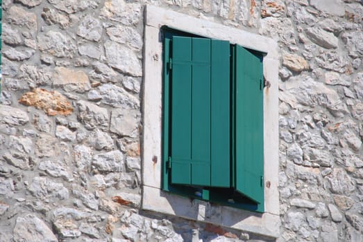 Closed green shutter in the window. Croatia, Vodice.