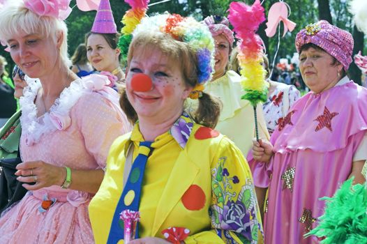 ST PETERSBURG, RUSSIA-JUNE 28, 2008: People playing clowns at outdoor carnival party "Life in Pink Festival"