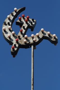 SICKLE AND HAMMER With a garland of electric lamps