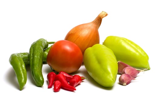 Still-life with fresh vegetables on a white background.