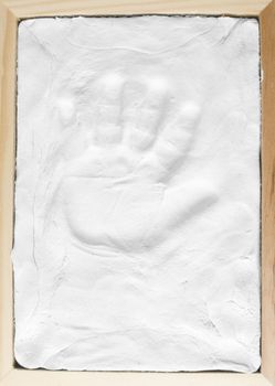 Small child memory handprint on clay in wooden frame