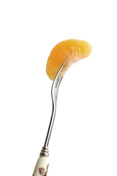 Tangerine segment on fork. Isolated on white background.
