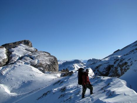 Mountains, caucasus, rocks, a relief, a landscape, the nature, a panorama, a landscape, a ridge, top, breed, the sky, reserve, a background, a kind, a route, a slope, peak, beauty, bright, a file, tourism, travel, winter, the tourist, the person, the guy, the man, sports, an ascension, the sun, snow