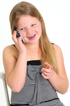beautiful blond girl talking on a mobile phone, pointing and smiling