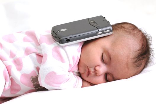 infant baby sleeping with a mobile phone