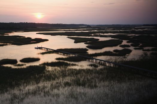 Aerial view of pier in coastal wetland on Bald Head Island, North Carolina.