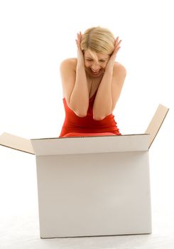 Happy girl in red dress with big white box