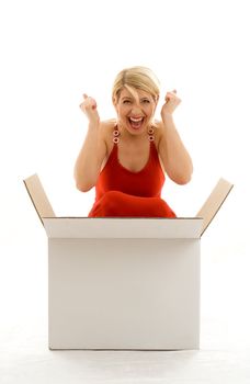 Happy girl in red dress with big blank white box